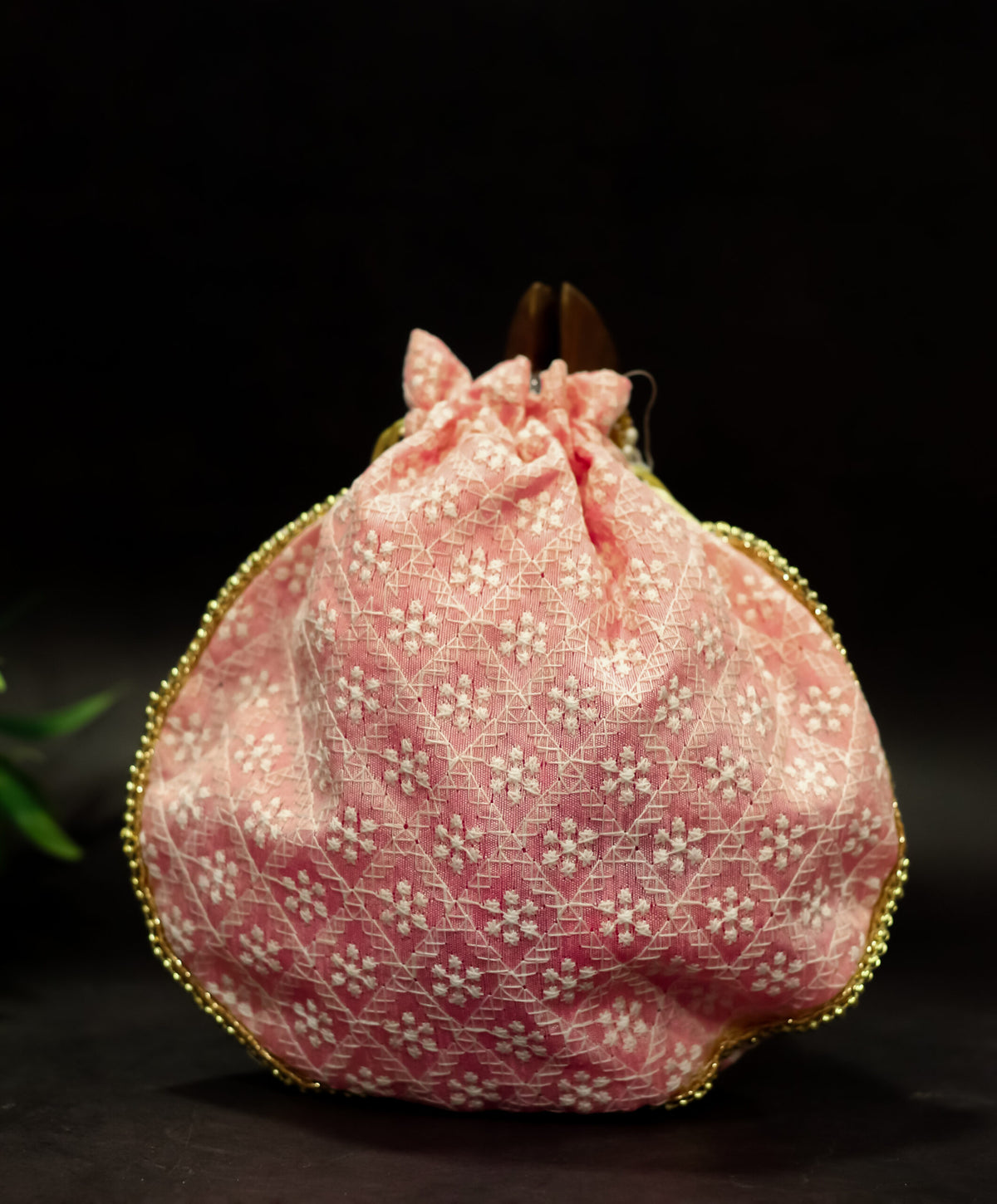 Cross embroidered potli with pearl handle