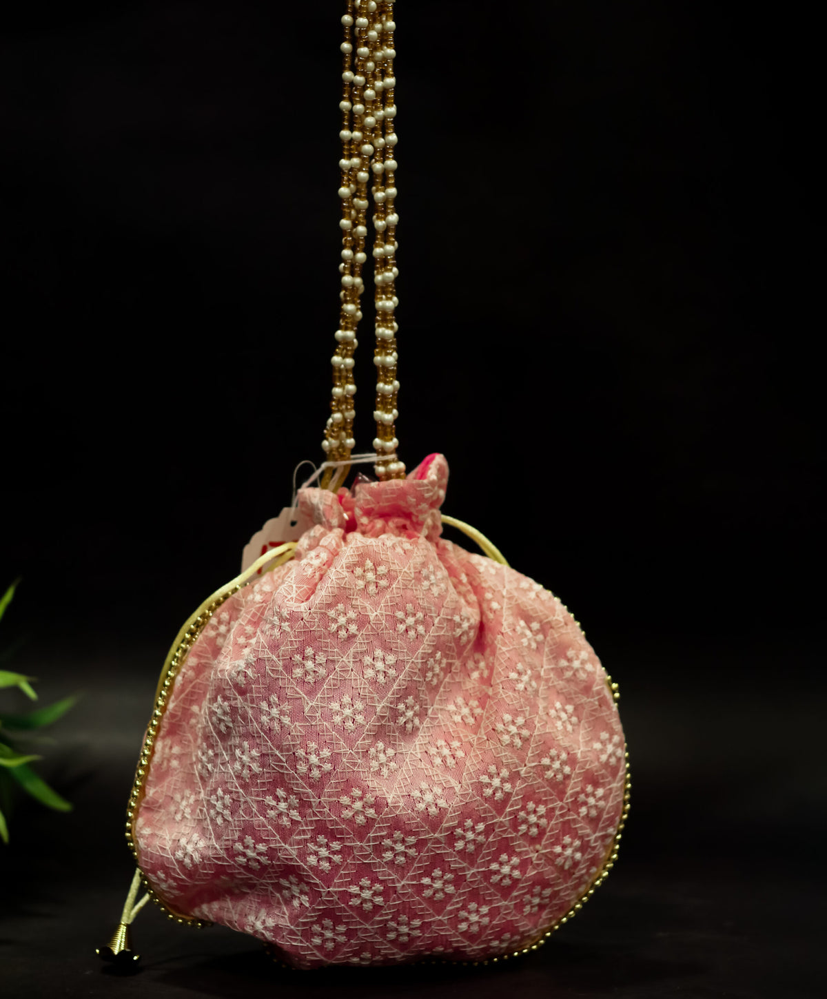 Cross embroidered potli with pearl handle