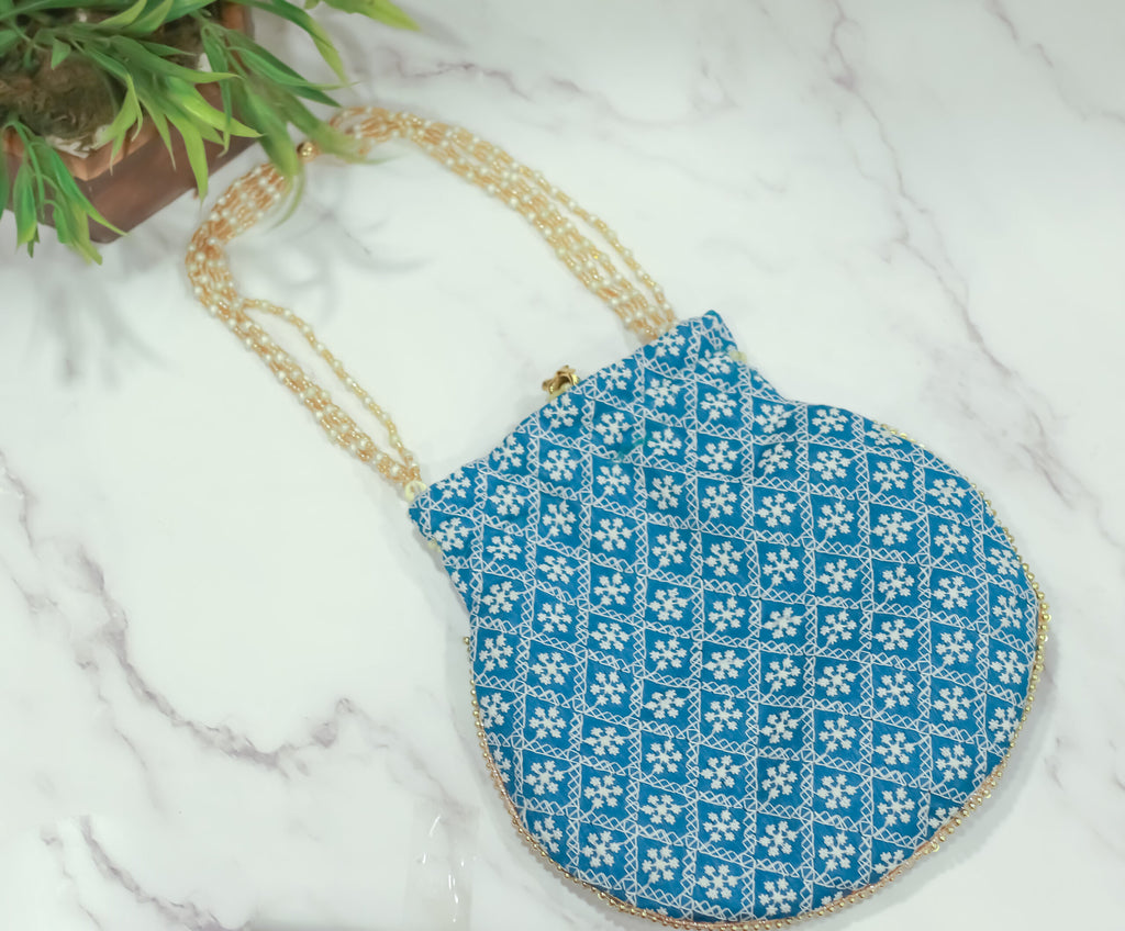 Cross embroidered potli with pearl handle