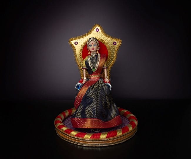 Puberty function doll on chair with plate
