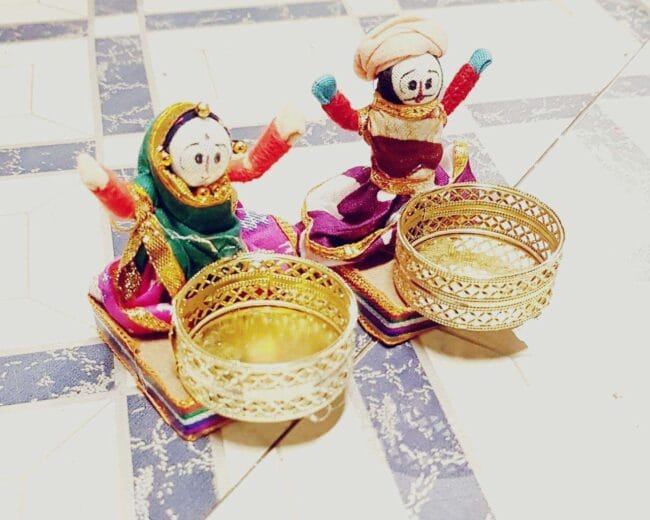 Sitting Doll Pair Candle Holder