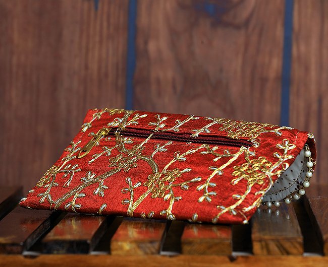 Golden embroidered flap clutch