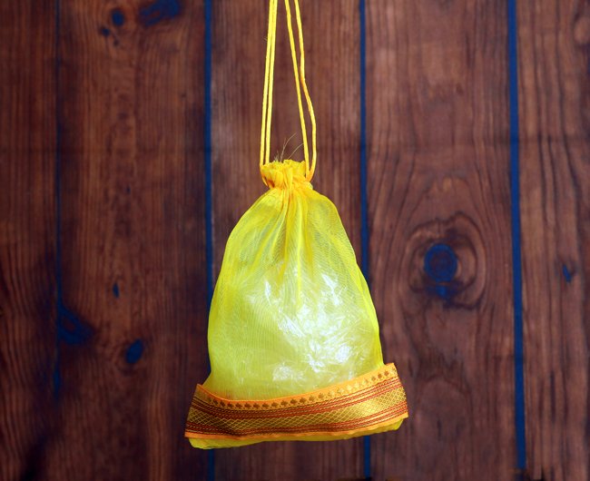 Golden Tissue Potli with Zari